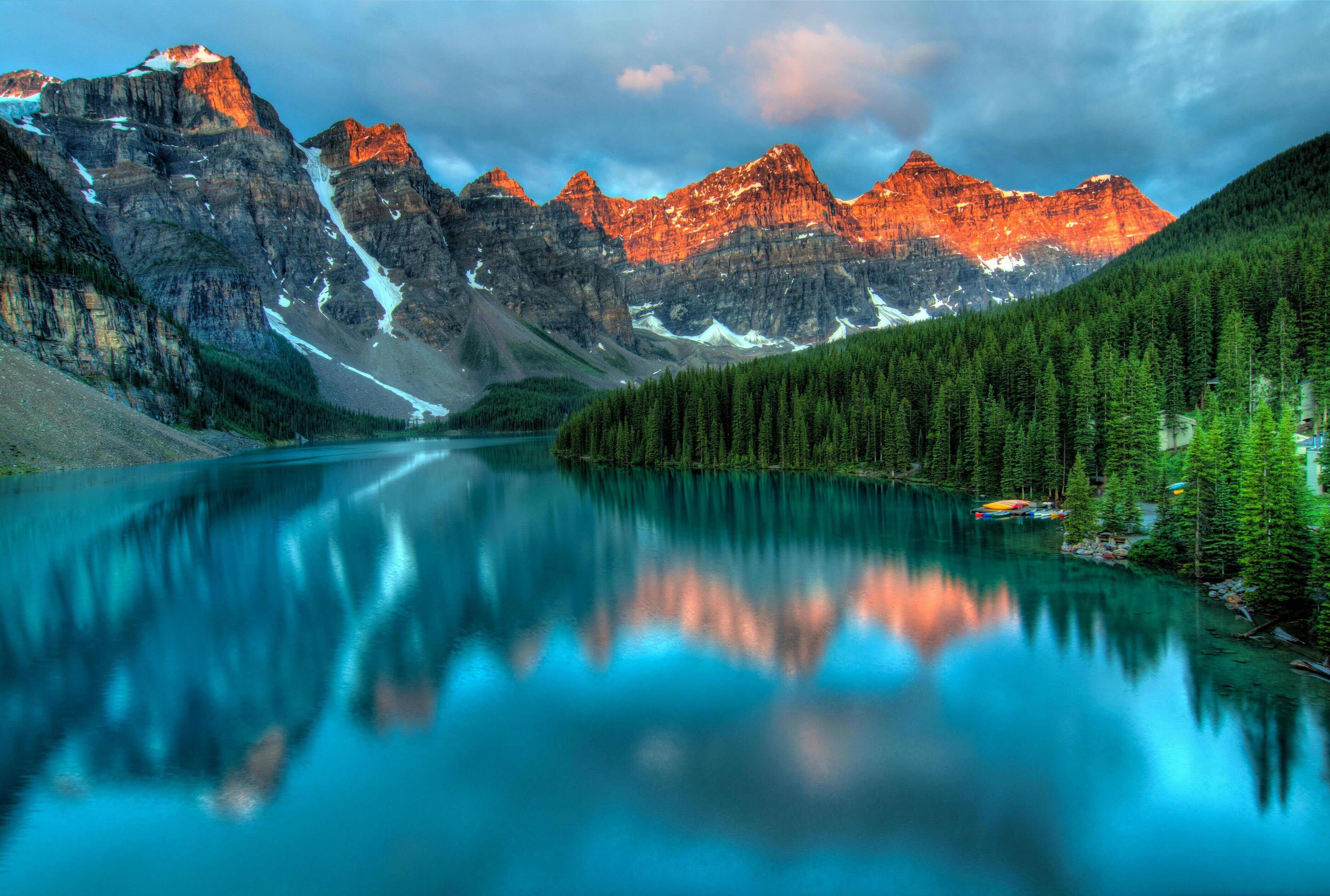 Alpine lake with mountain reflection in clear water